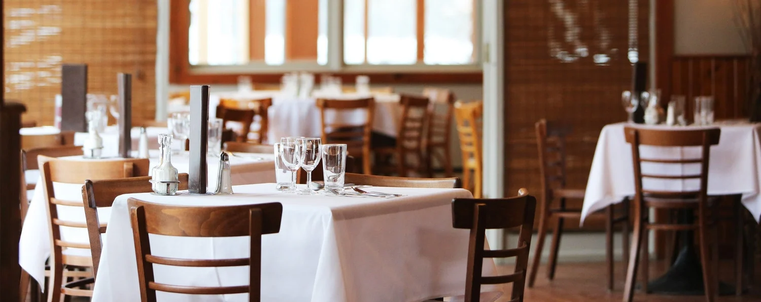 Warm restaurant dining room ready for service